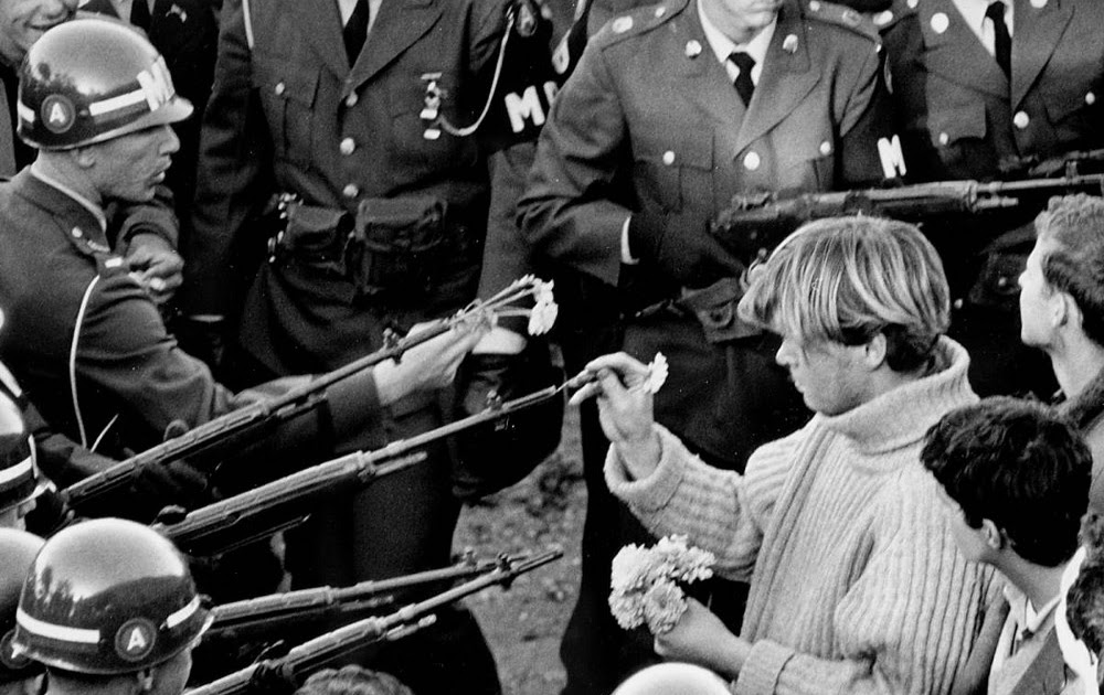 Flower Power by Bernie Boston--George Harris places flower in gun